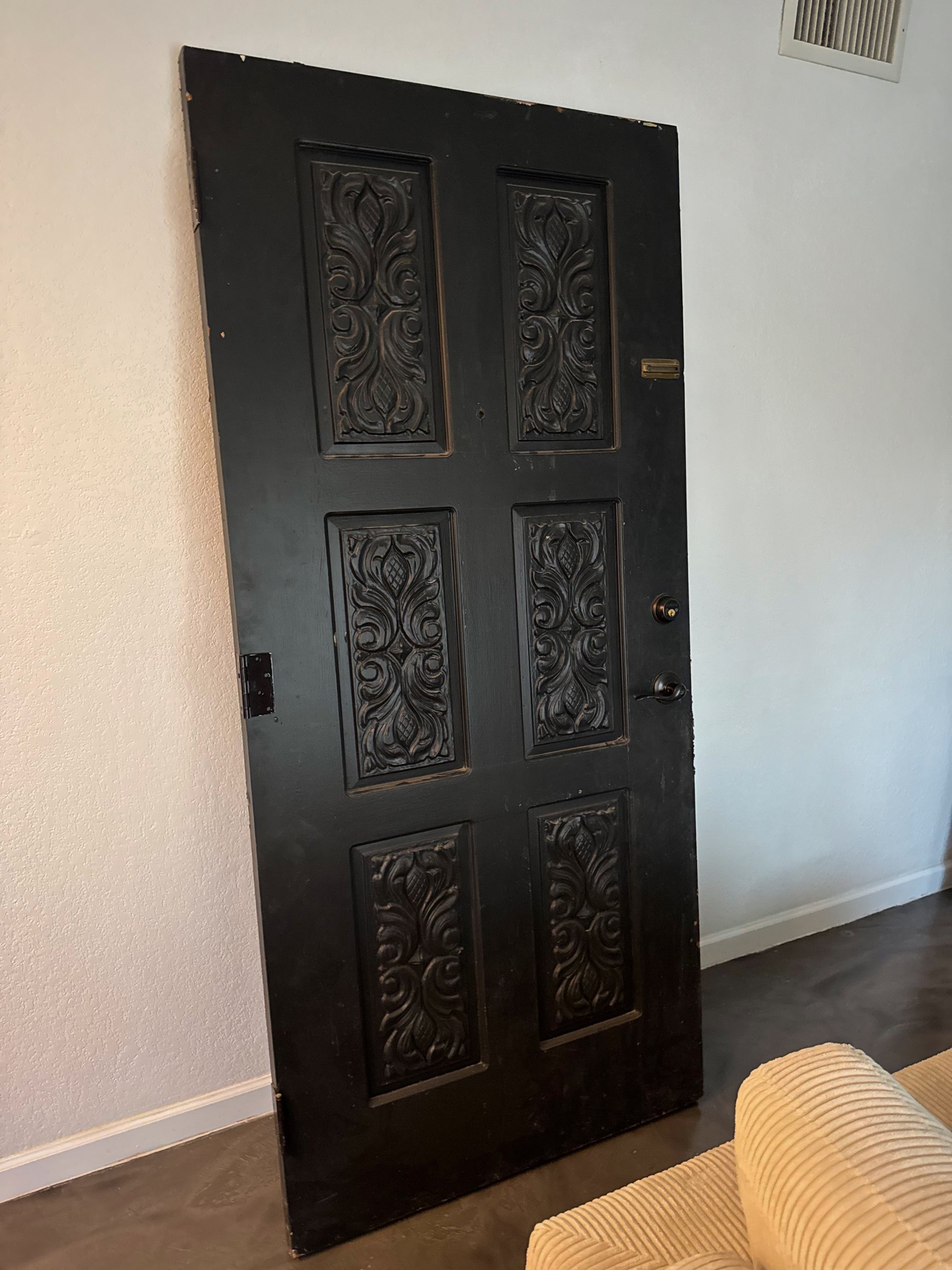 Decorative carved door and finish detail